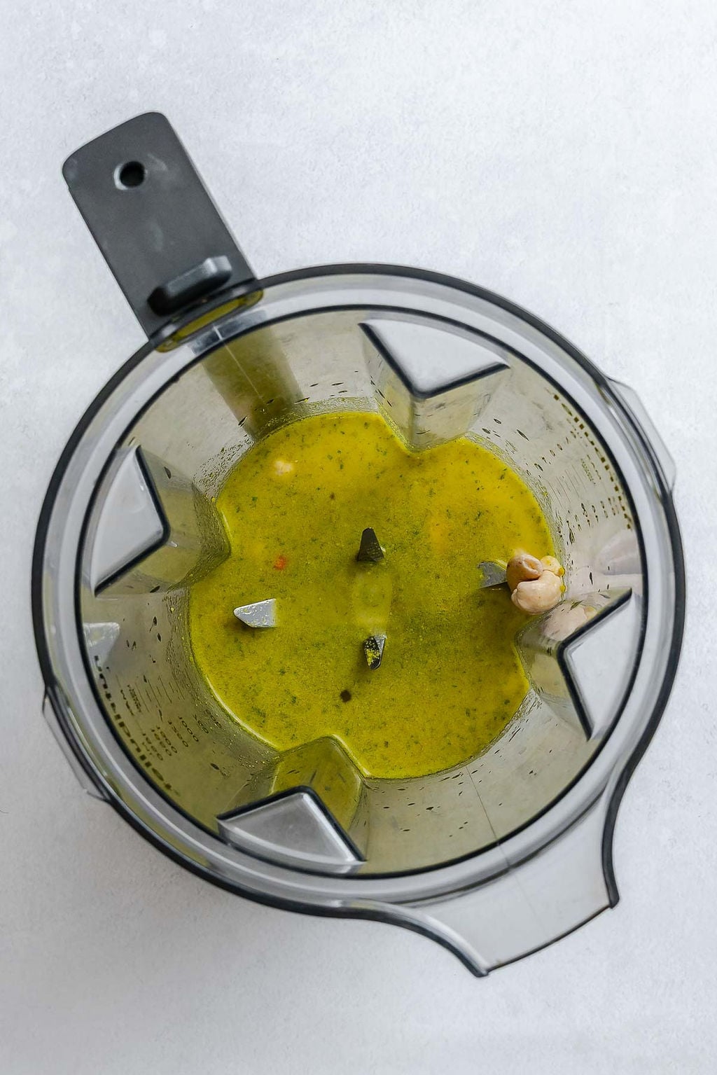 Process shot showing ingredients in a blender.