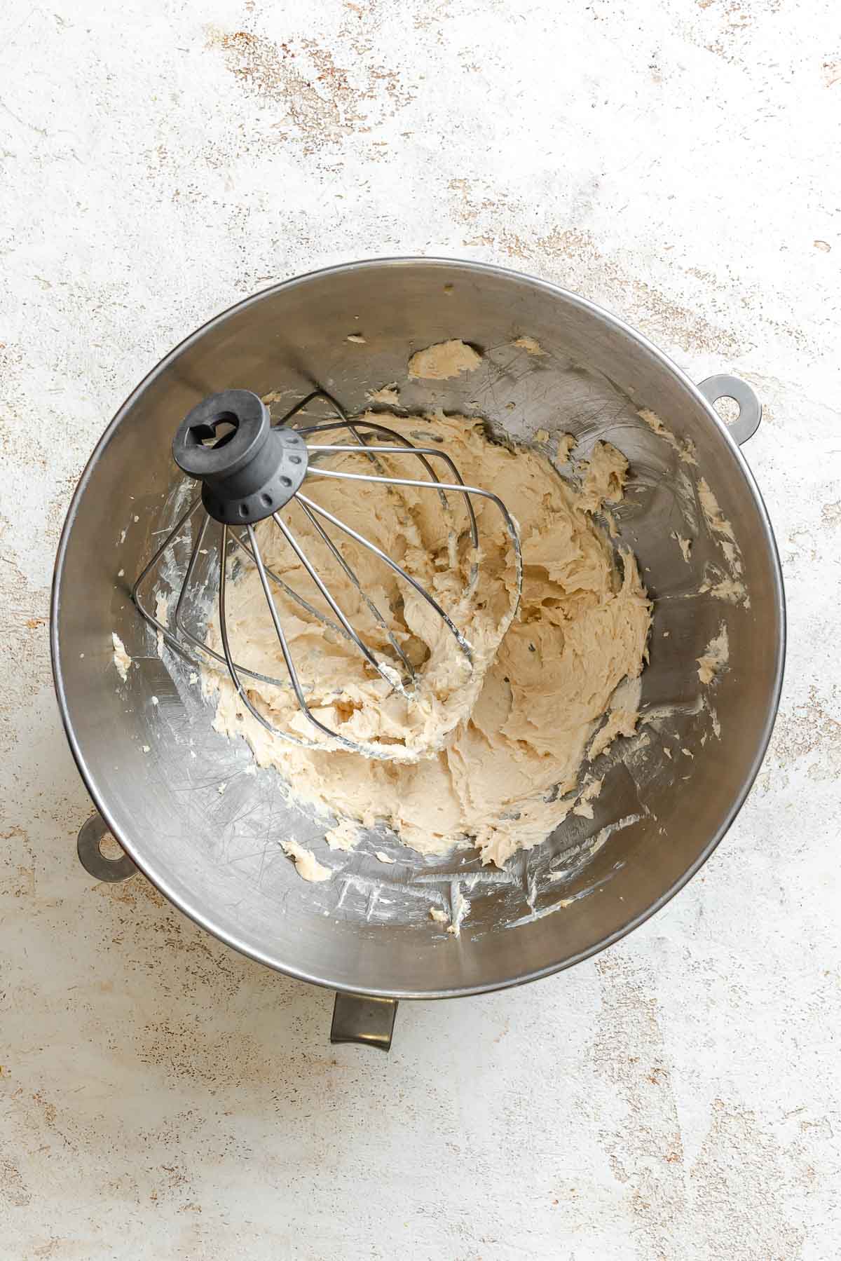 Process shot showing mixing ingredients in a bowl.