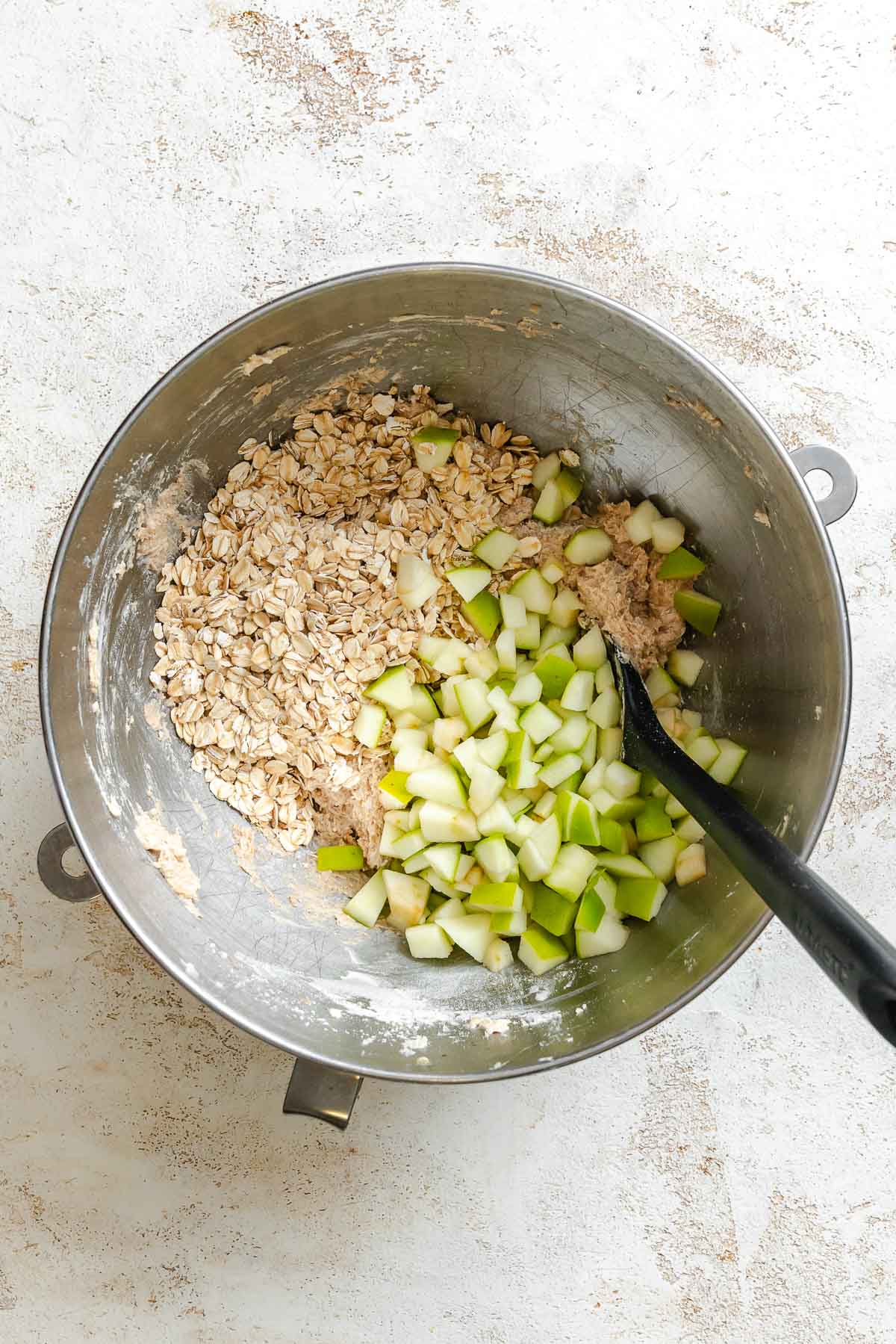 Process shot showing mixing ingredients in a bowl.