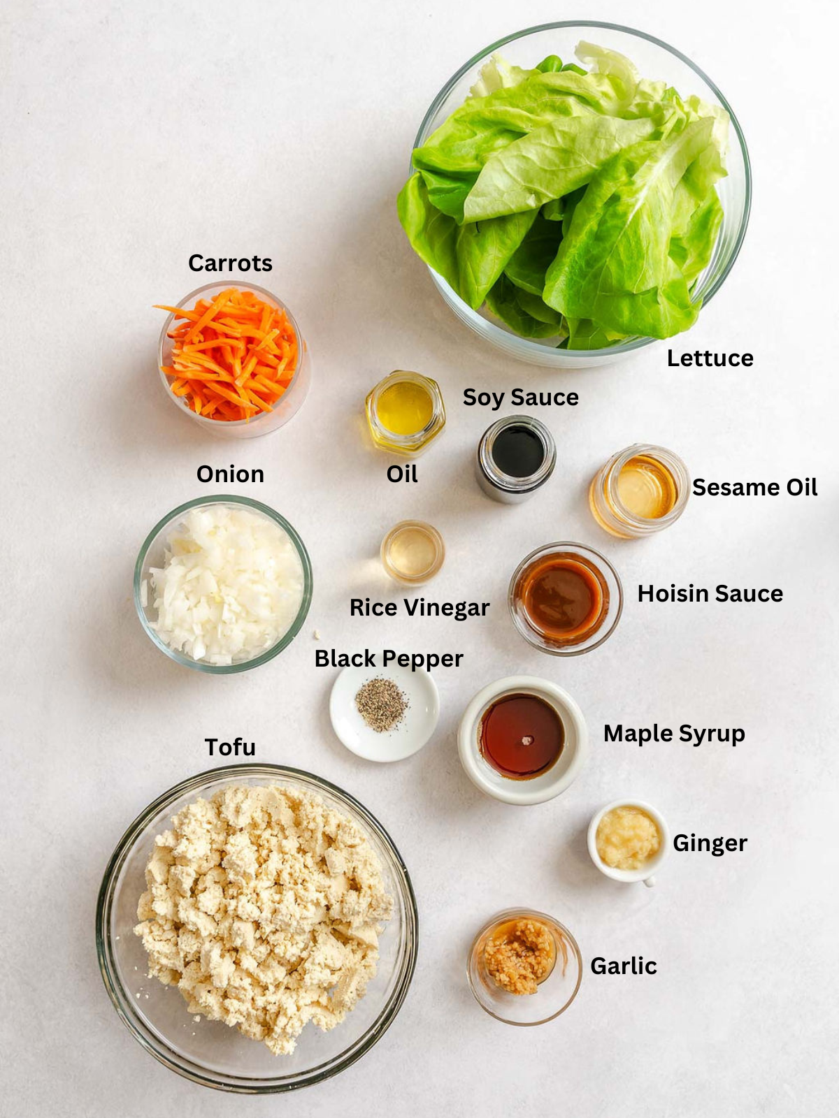 Ingredients for Asian Tofu Lettuce Wraps measured out on a white surface.