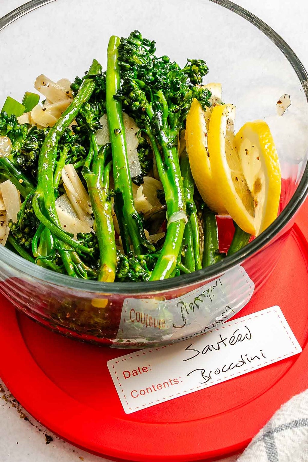 Completed Sautéed Broccolini in a storage dish.