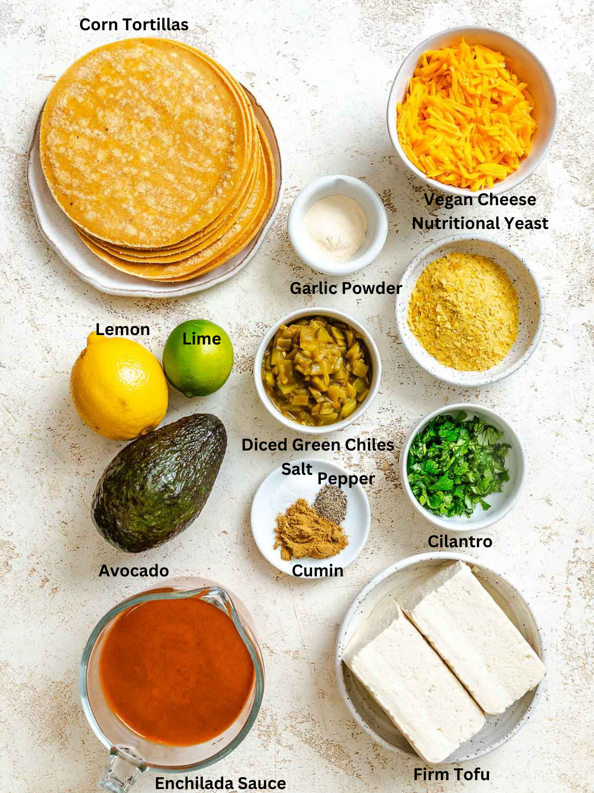 Ingredients for Vegan Cheese Enchiladas measured out on a white surface.