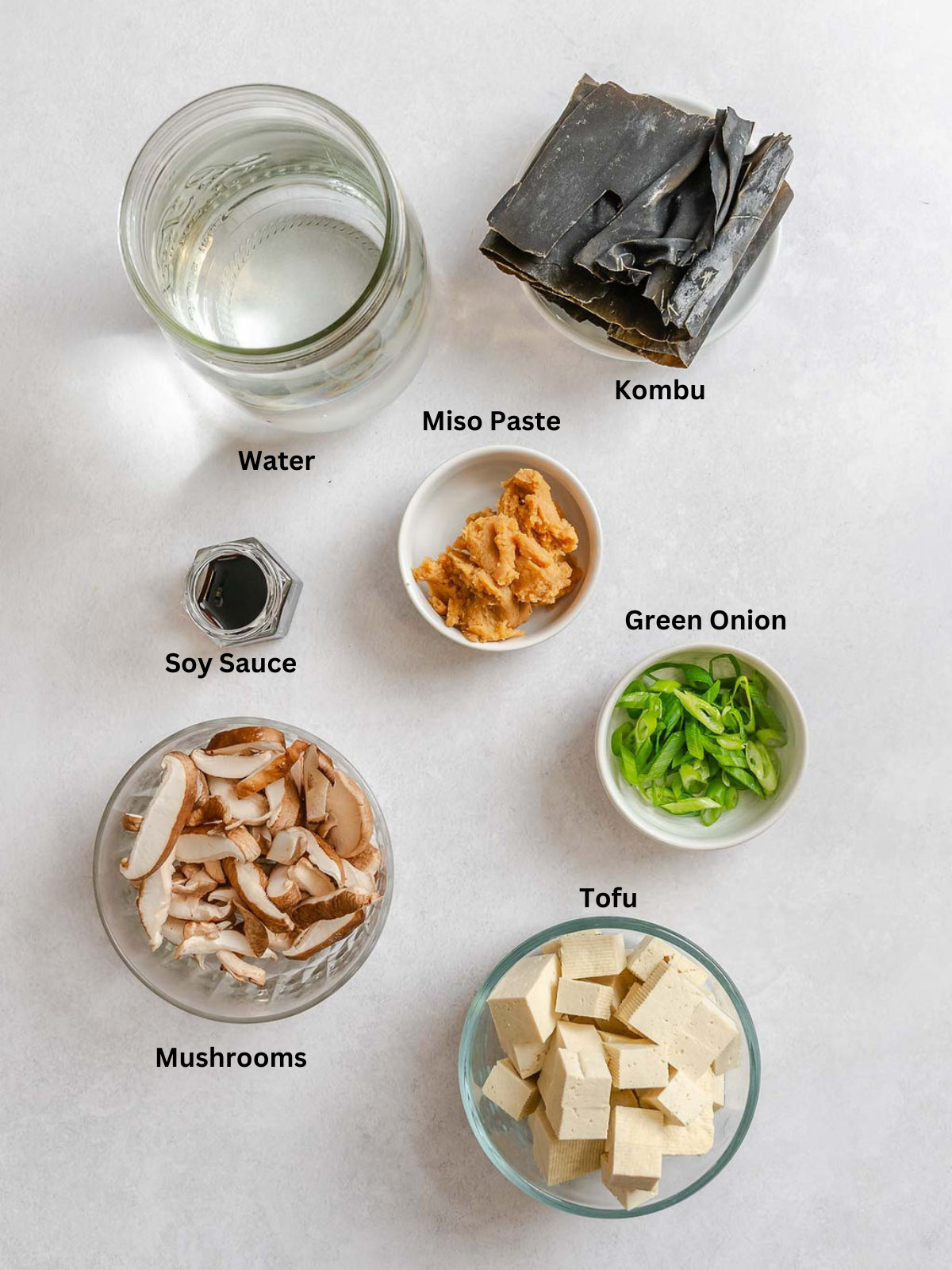 Ingredients for Vegan Miso Soup measured out on a white surface.