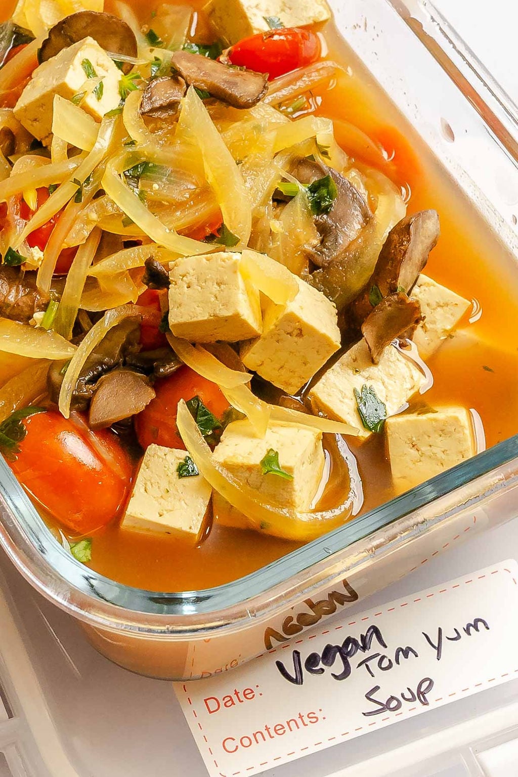 Completed Vegan Tom Yum Soup in a storage container.