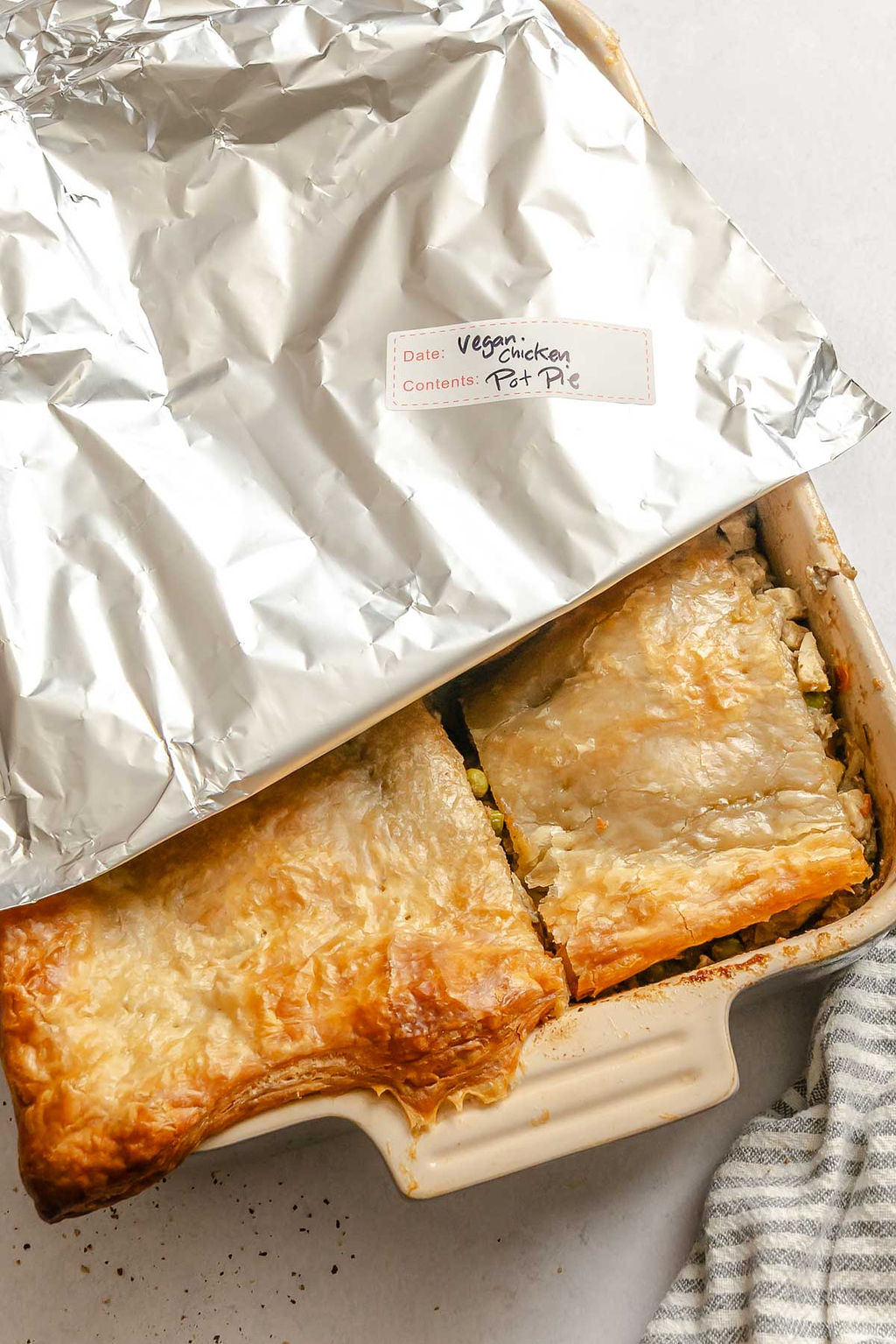 Completed Vegan Chicken Pot Pie (Casserole) in baking dish with foil on top.
