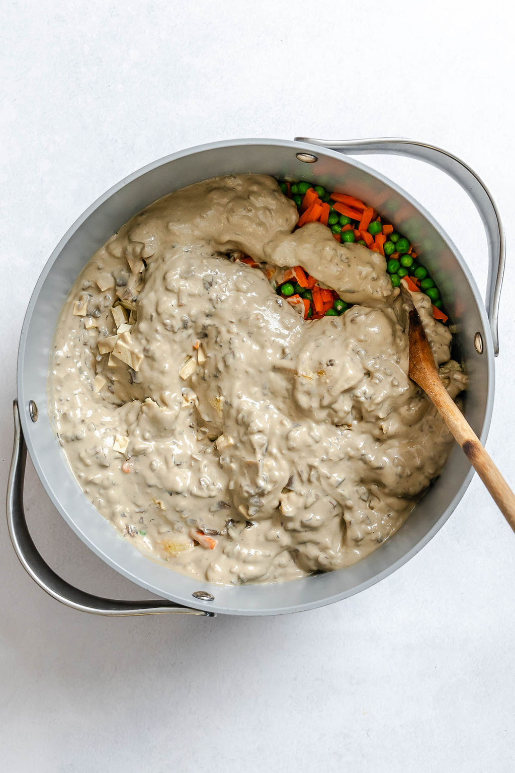 Process shot showing stirring ingredients in a bowl.