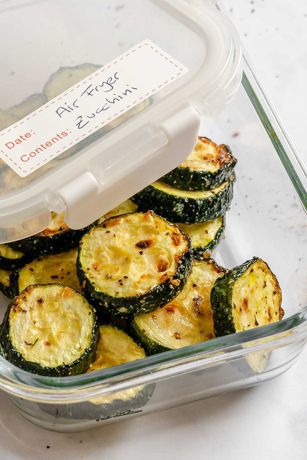 Completed Quick Air Fryer Zucchini in a storage container.