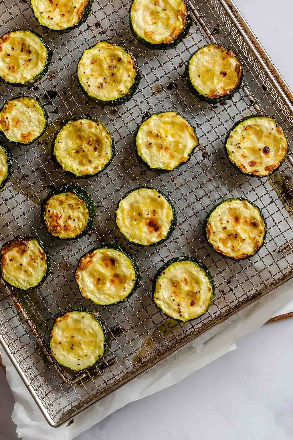 Completed Quick Air Fryer Zucchini on a wire rack.
