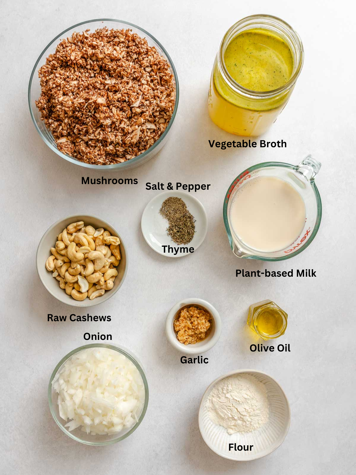 Ingredients for Vegan Cream of Mushroom Soup measured out on a white surface.
