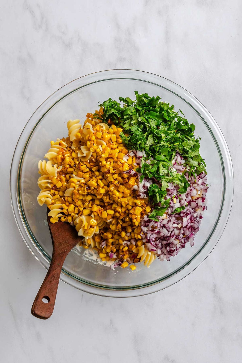 Process shot showing ingredients added together in a bowl.