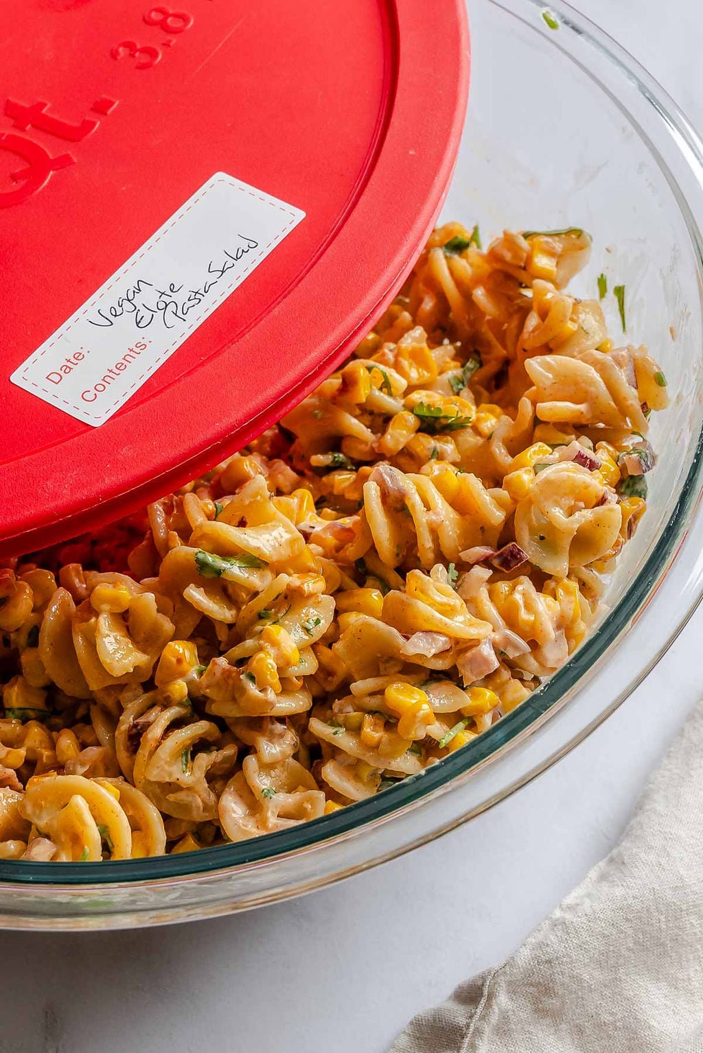 Completed Elote Pasta Salad (Mexican Street Corn) in a storage container.