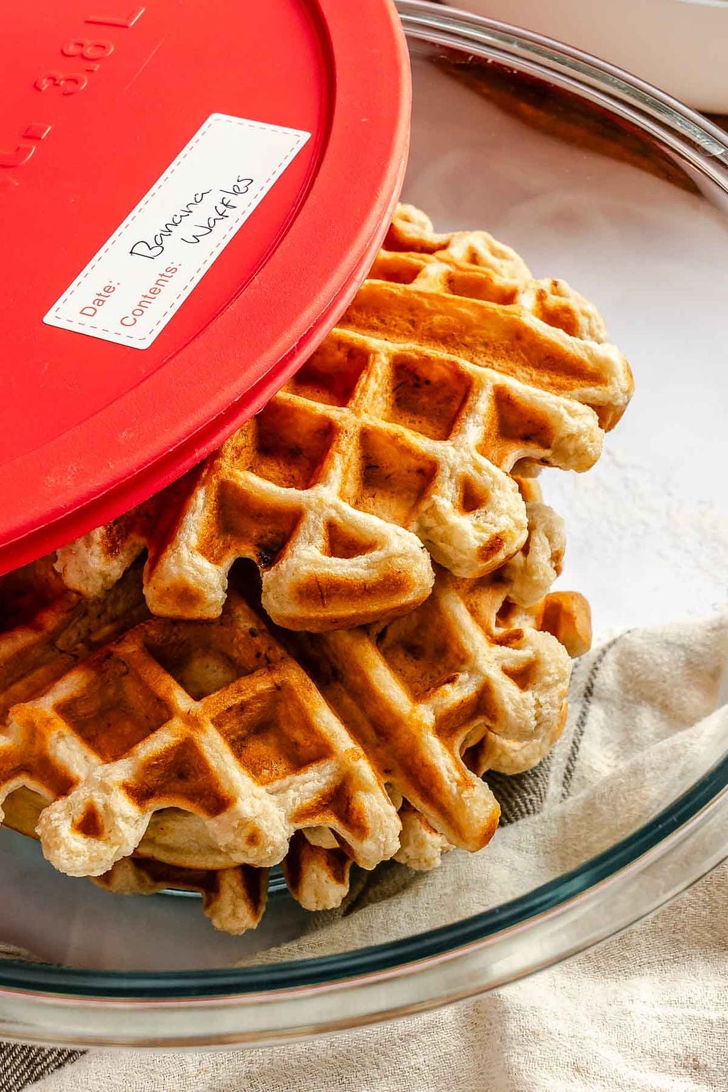Completed Easy Vegan Banana Waffles in a storage container.