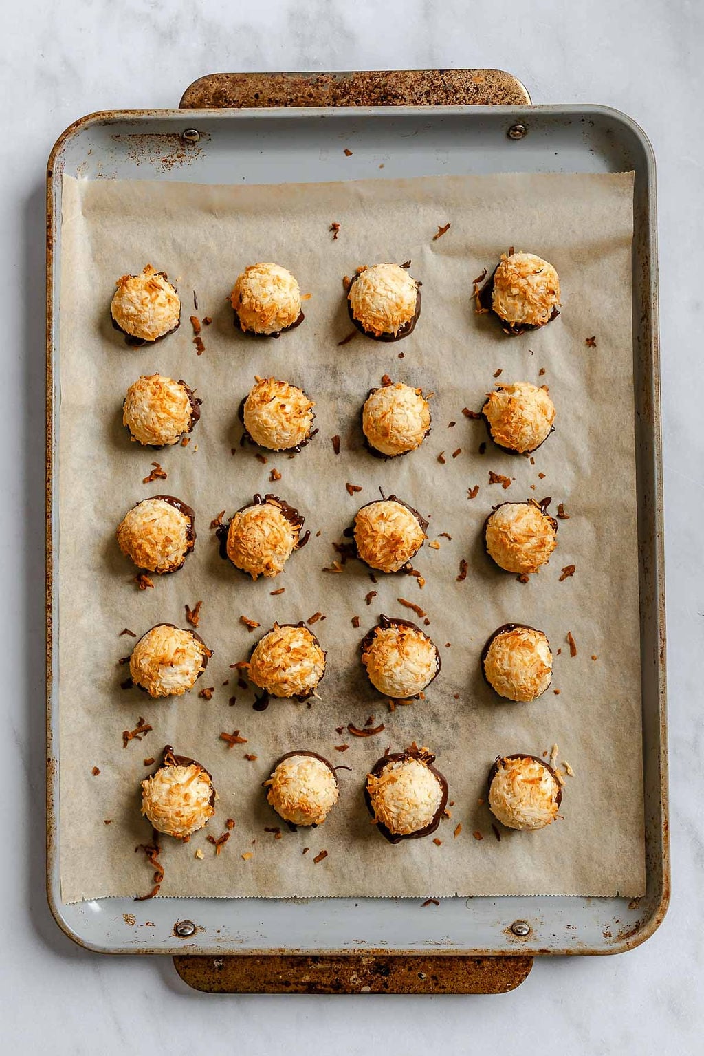 Process shot showing Vegan Coconut Macaroons on a baking sheet.