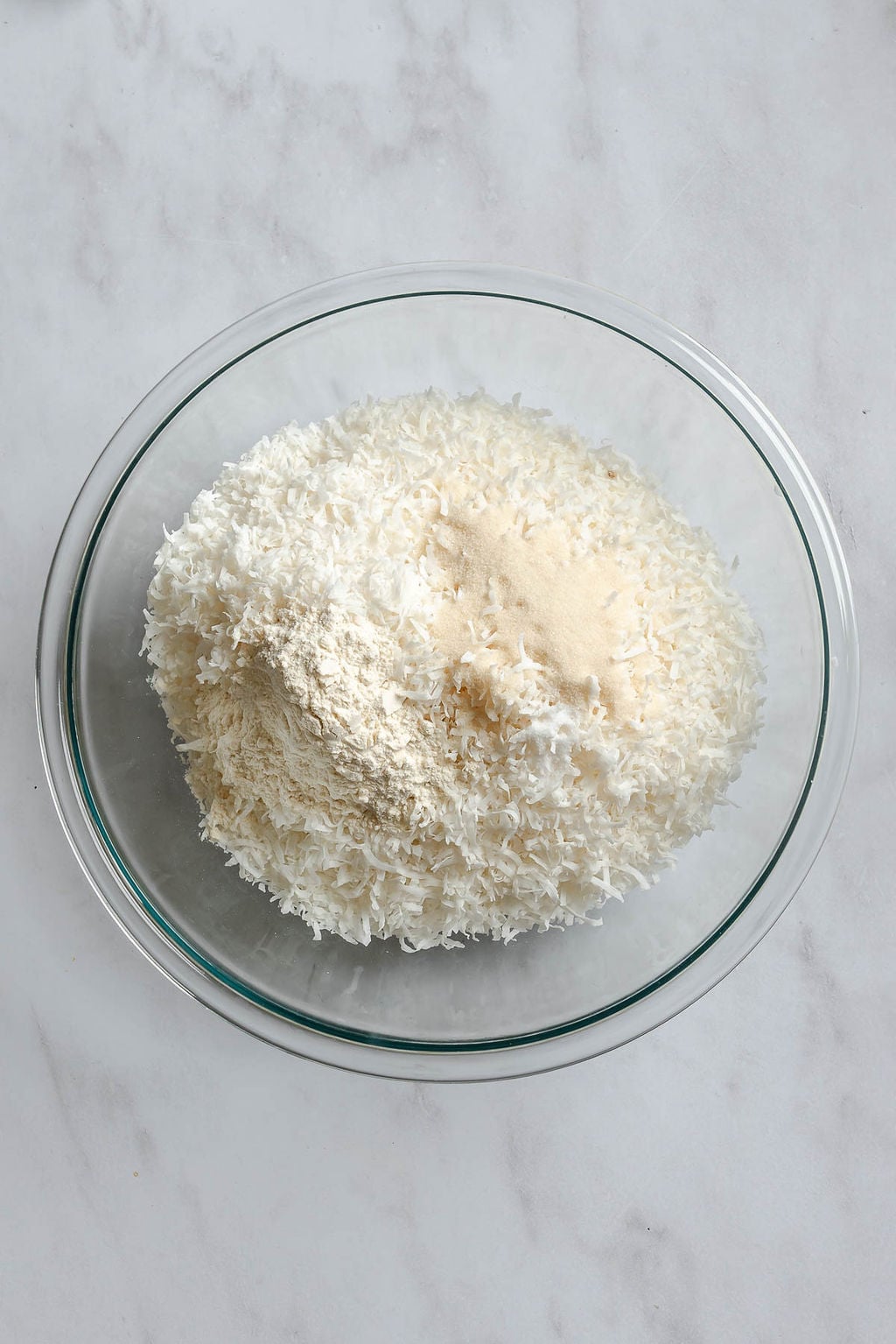 Process shot showing mixing ingredients in a bowl.
