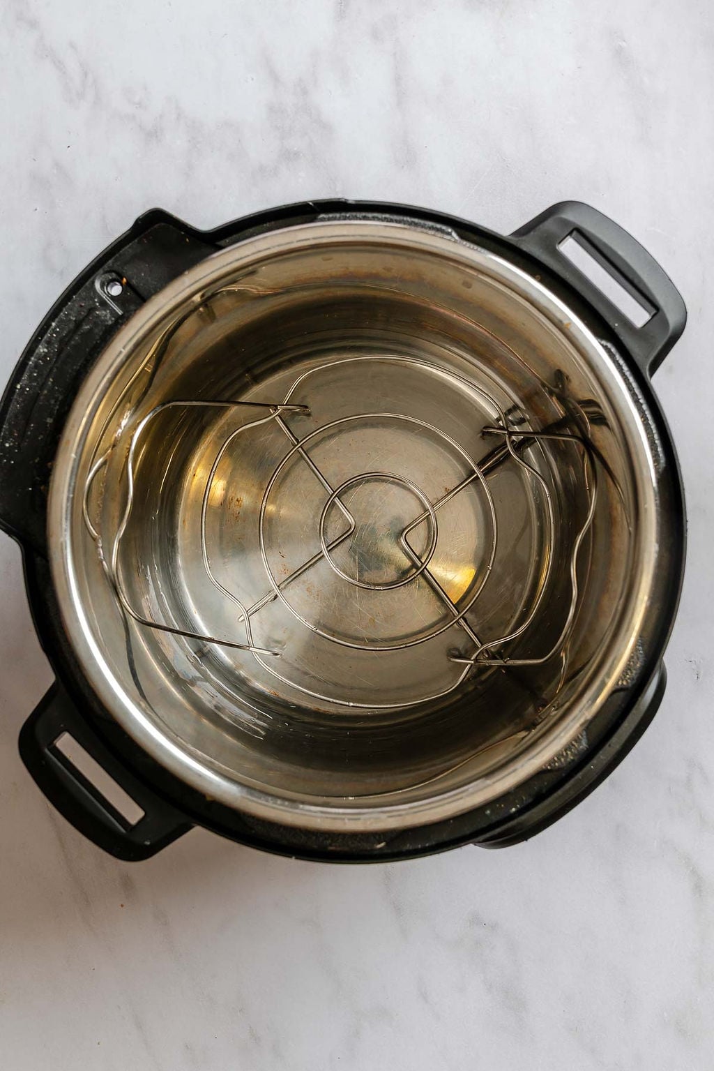 Process shot showing water added to instant pot.