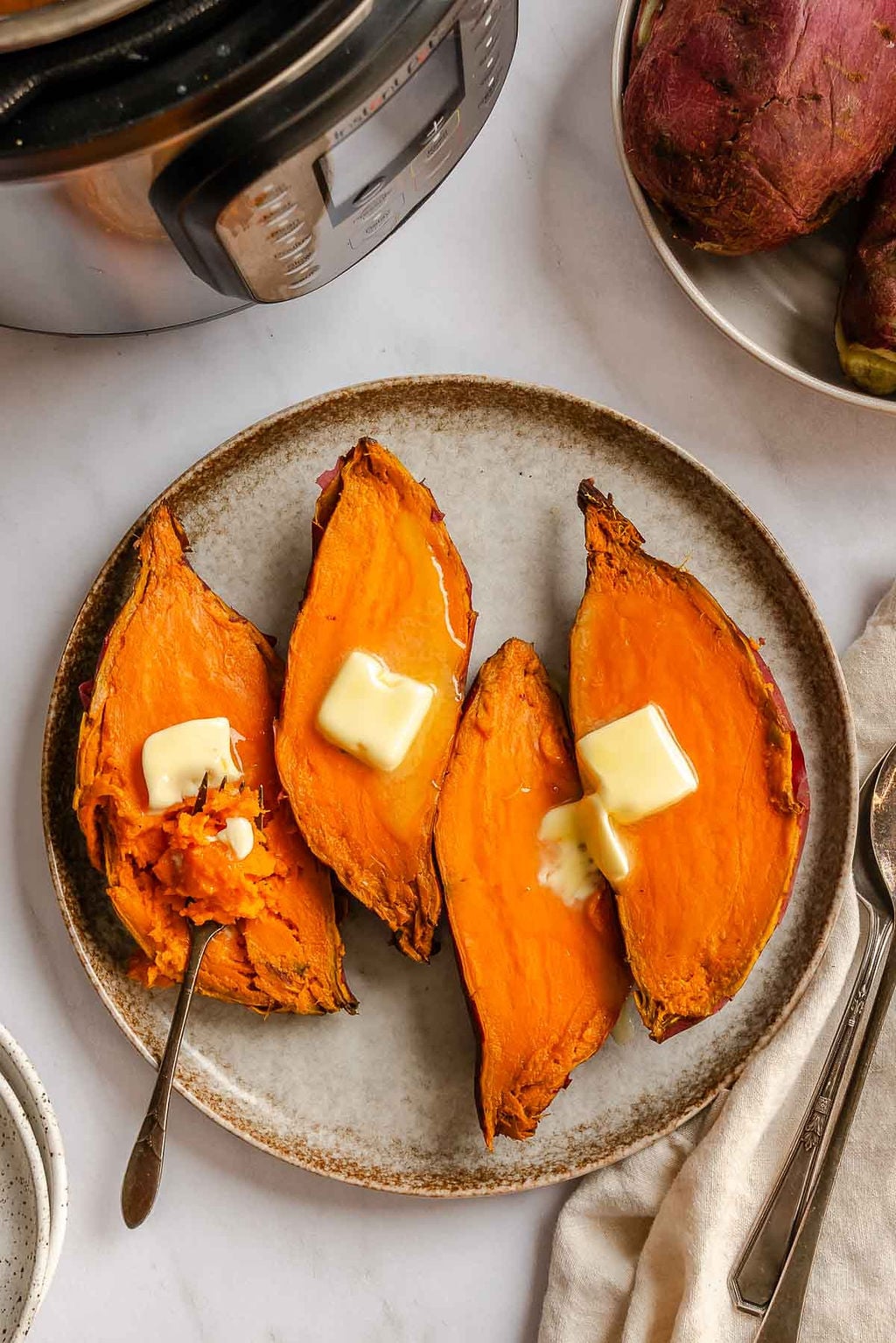 Completed Instant Pot Sweet Potatoes on a plate. 