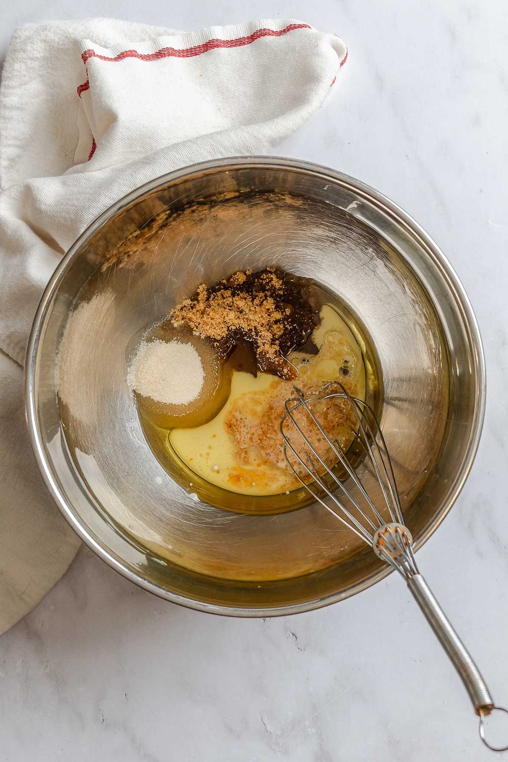 Process shot showing mixing ingredients in a bowl.
