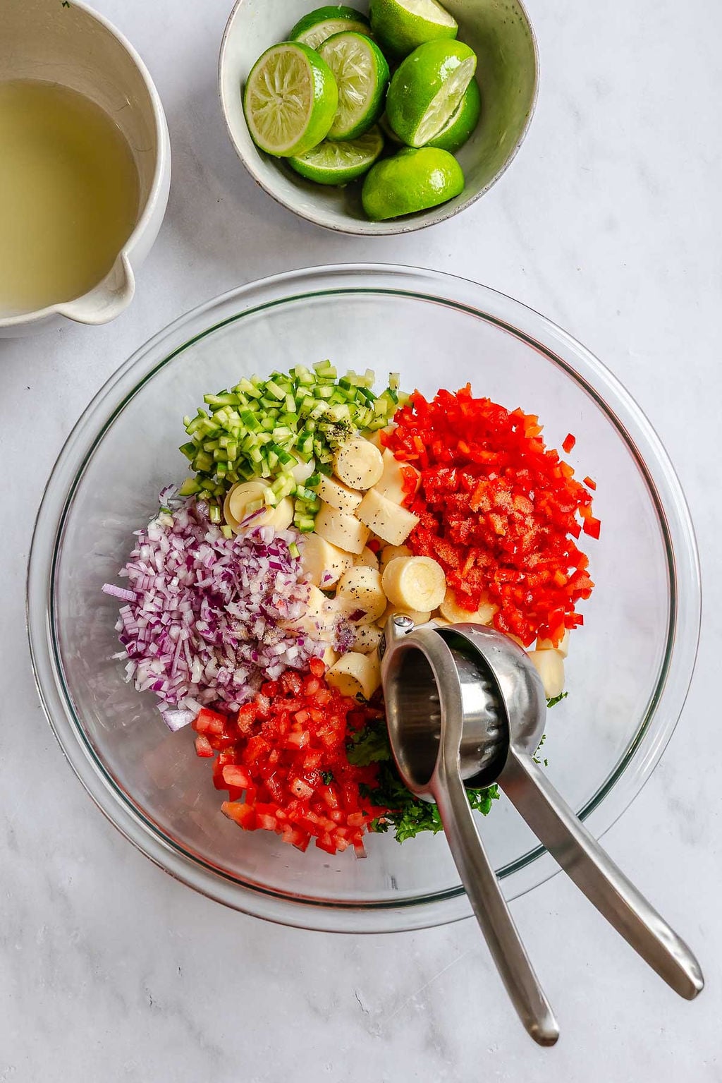 Process shot showing ingredients added to a bowl.