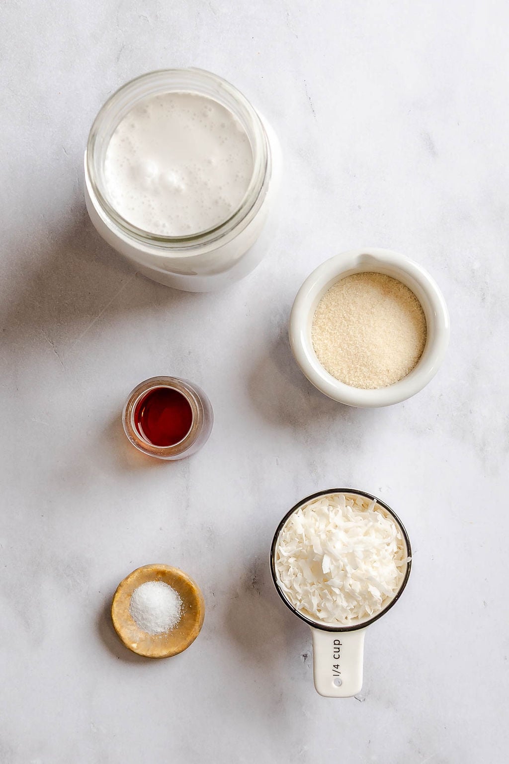 Ingredients for Ninja Creami Coconut Ice Cream measured out on a white surface.