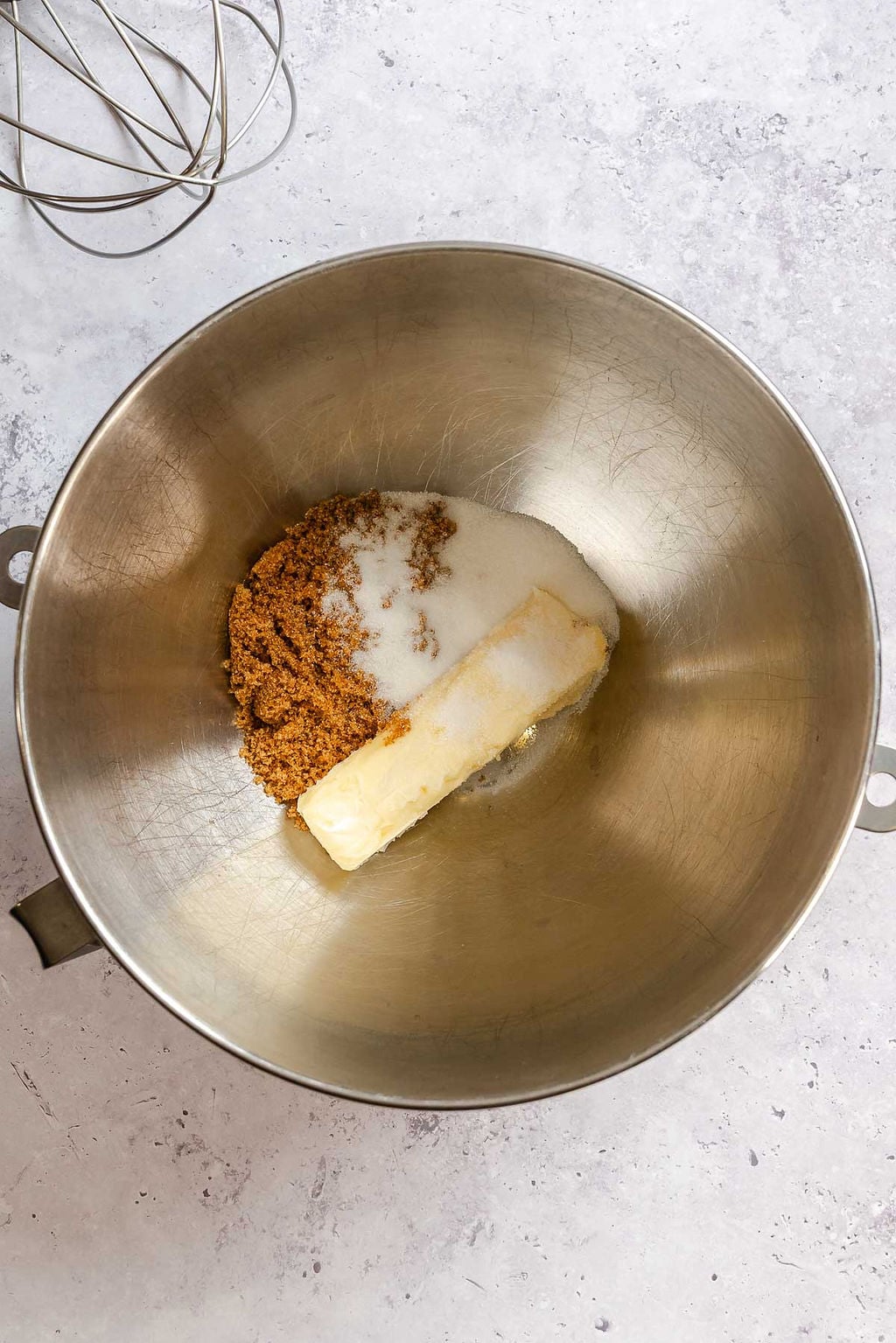 Process shot showing ingredients added to mixing bowl.