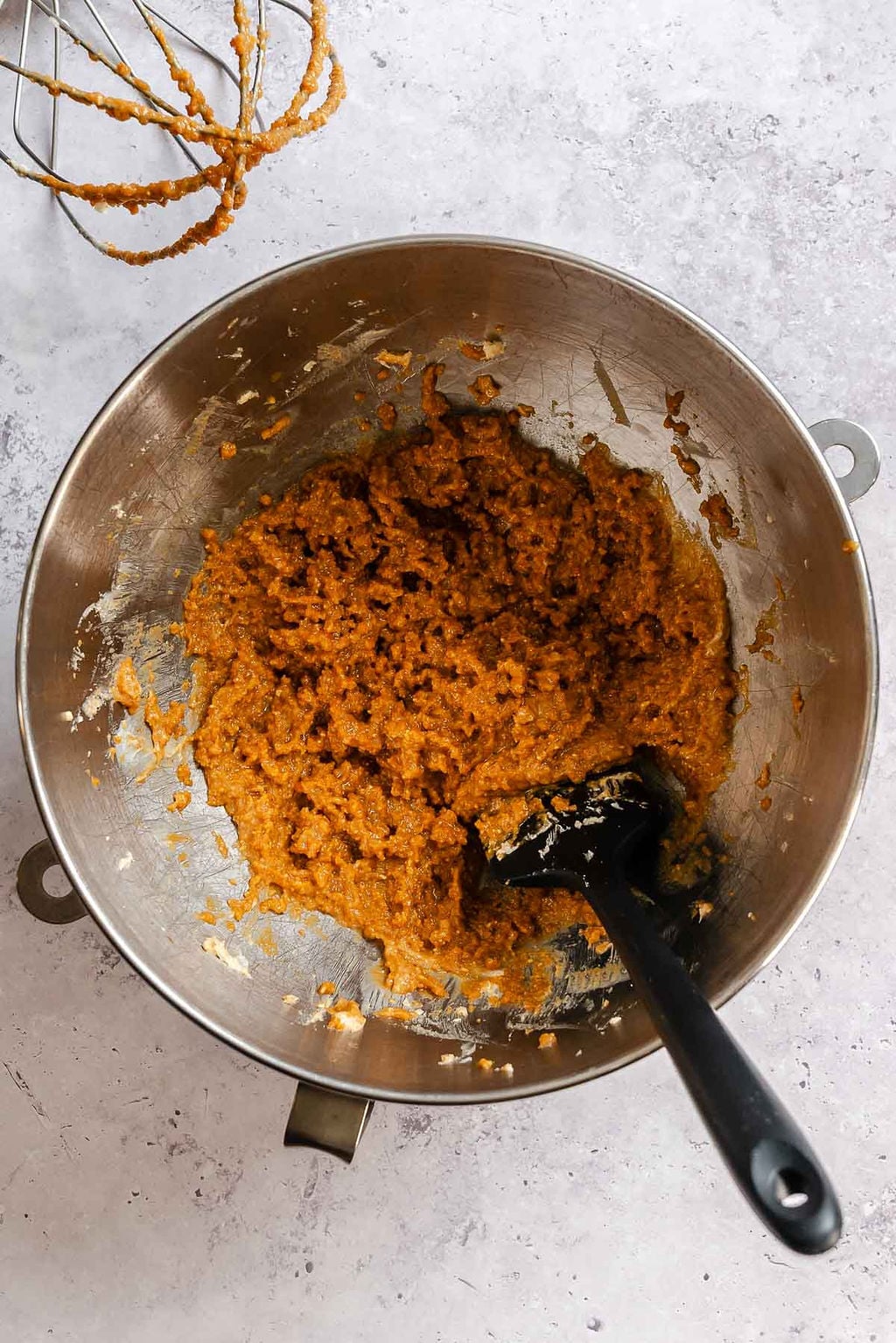 Process shot showing mixing ingredients in mixing bowl.