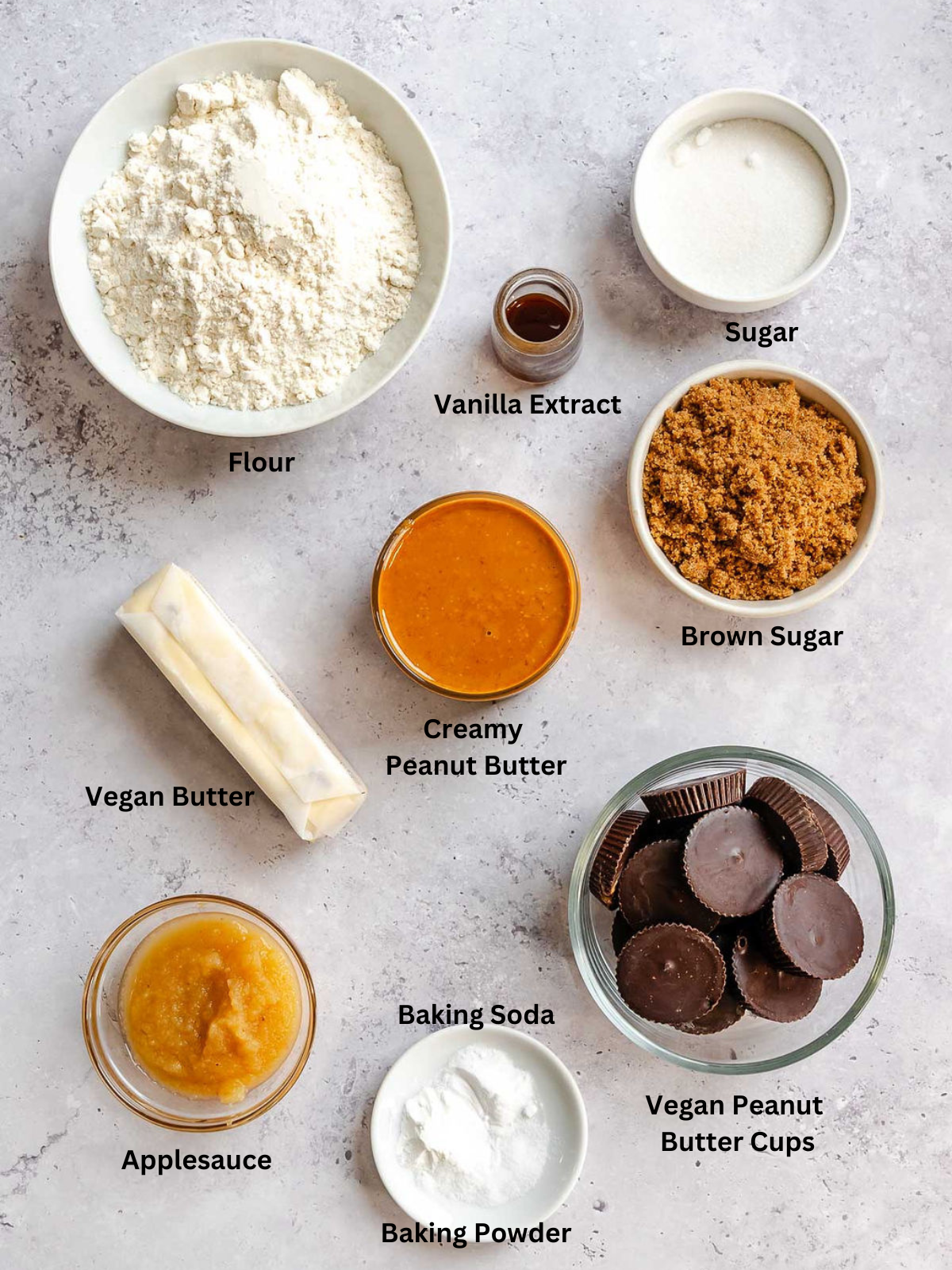 Ingredients for Peanut Butter Cup Cookies measured out on a white surface.
