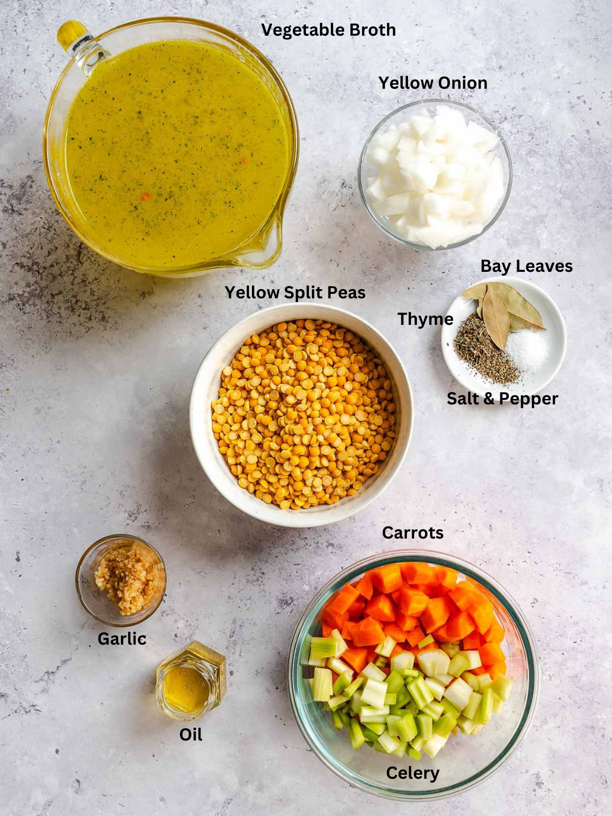 Ingredients for Easy Yellow Split Pea Soup measured out on a white surface.