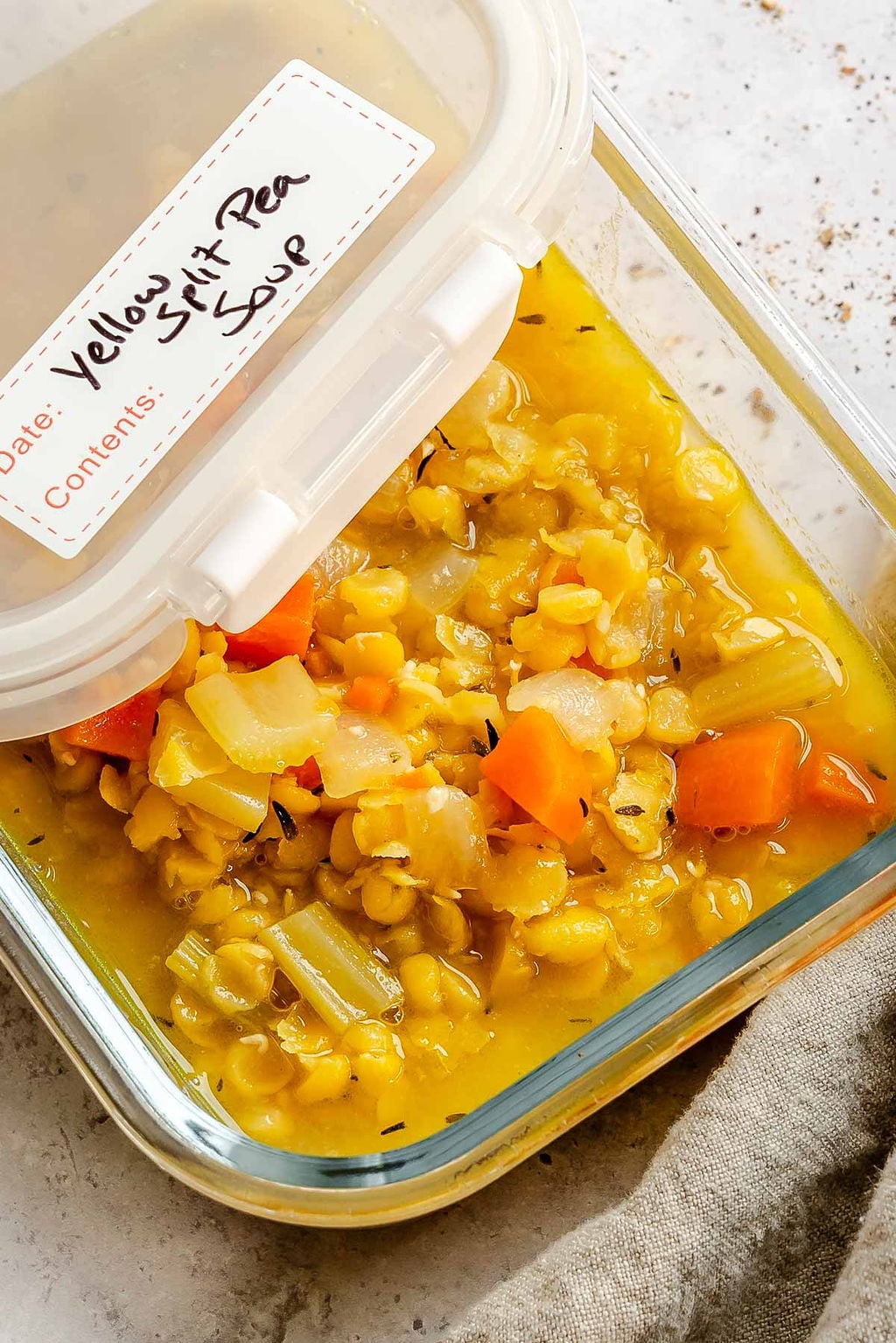 Completed Easy Yellow Split Pea Soup in a storage container.