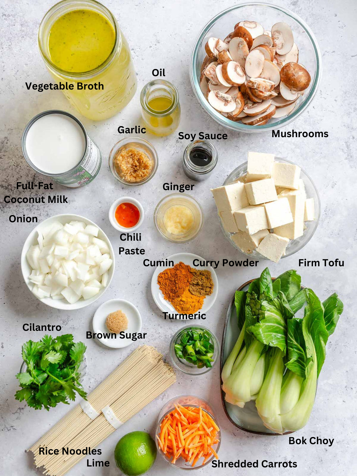 Ingredients for Easy Vegan Laksa measured out on a white surface.
