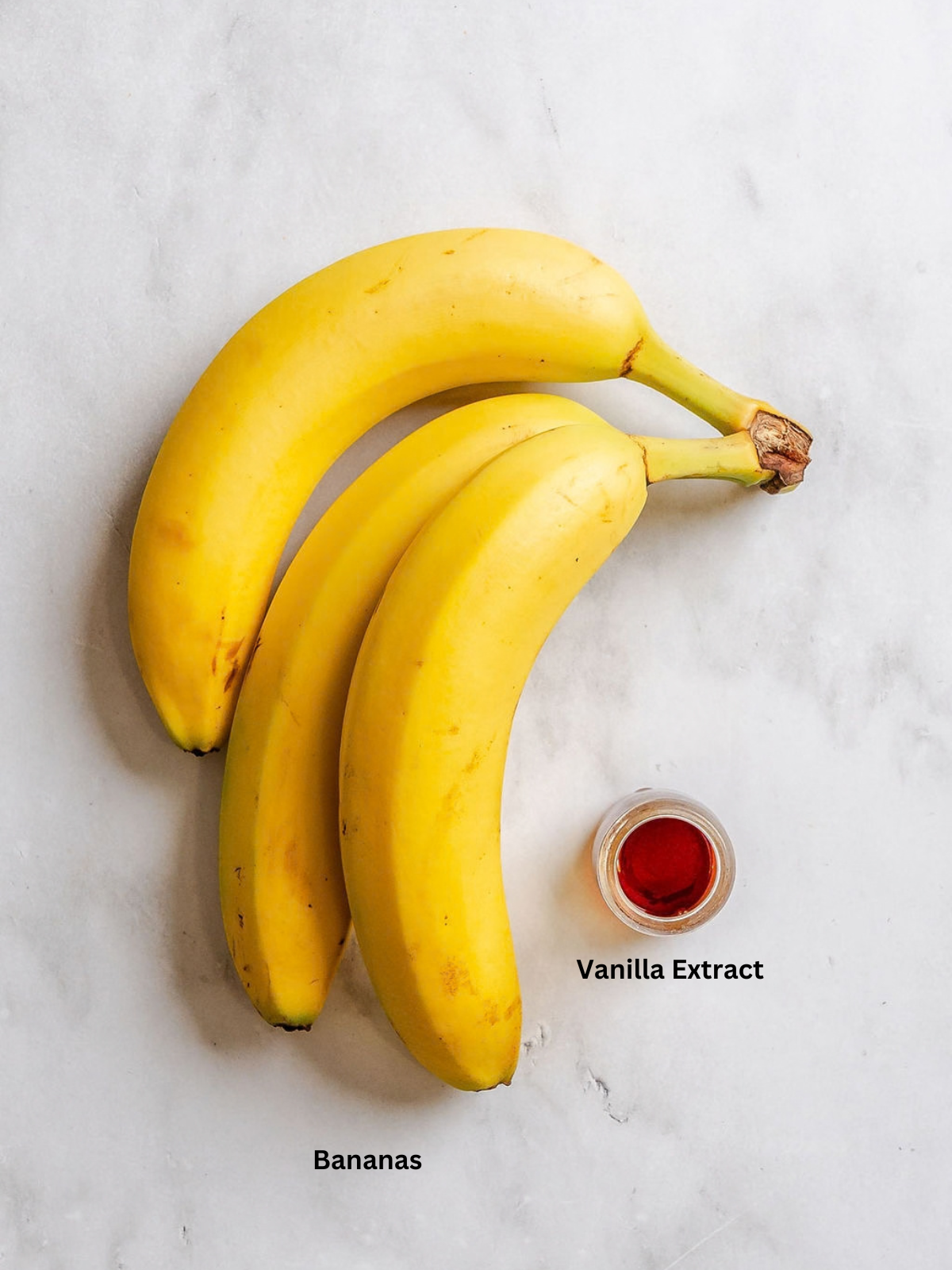 Ingredients for Ninja Creami Banana Ice Cream measured out on a white surface.